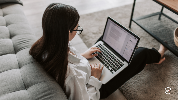 A woman on her laptop in her home