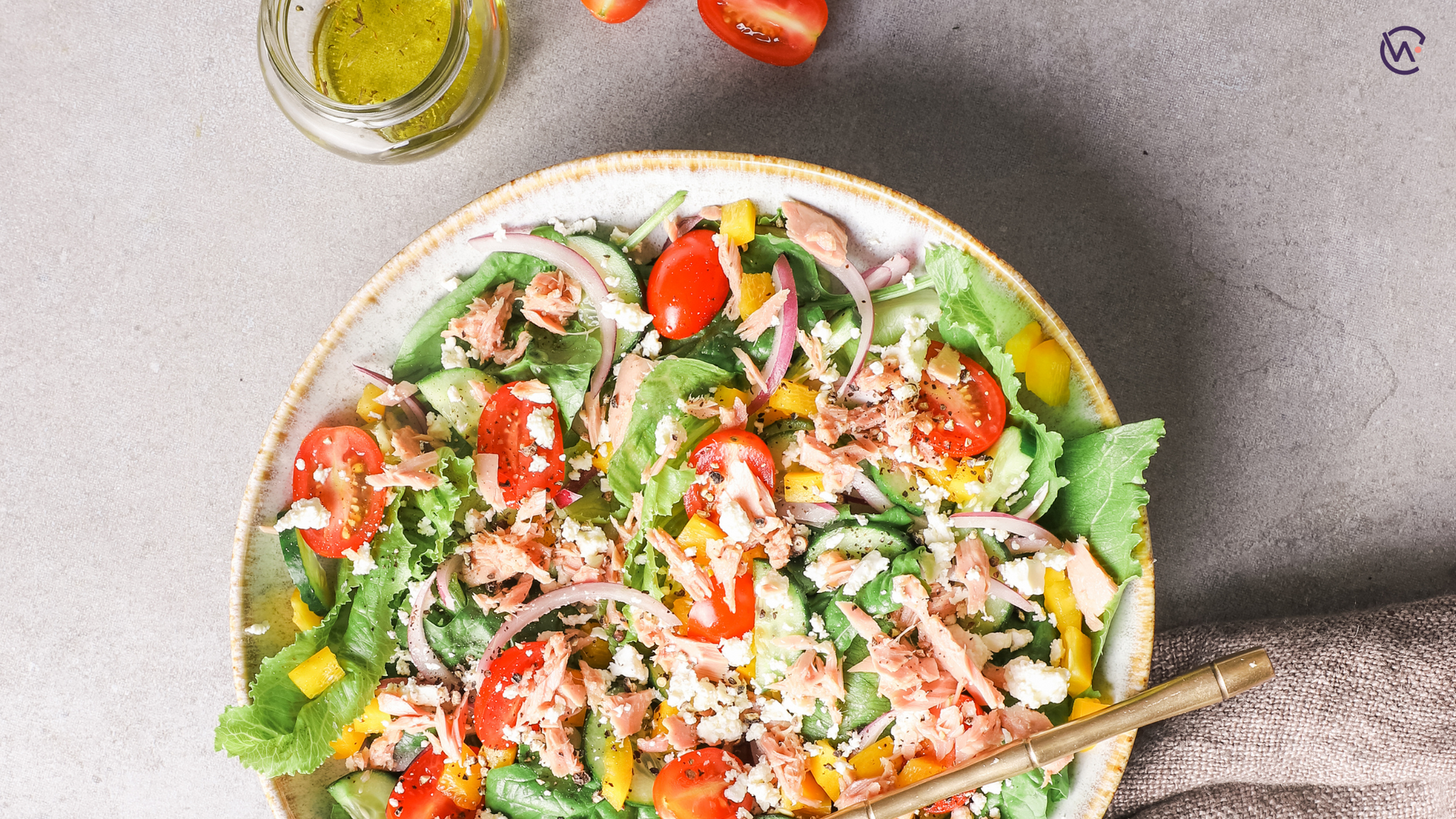 A large bowl of colourful salad with tuna