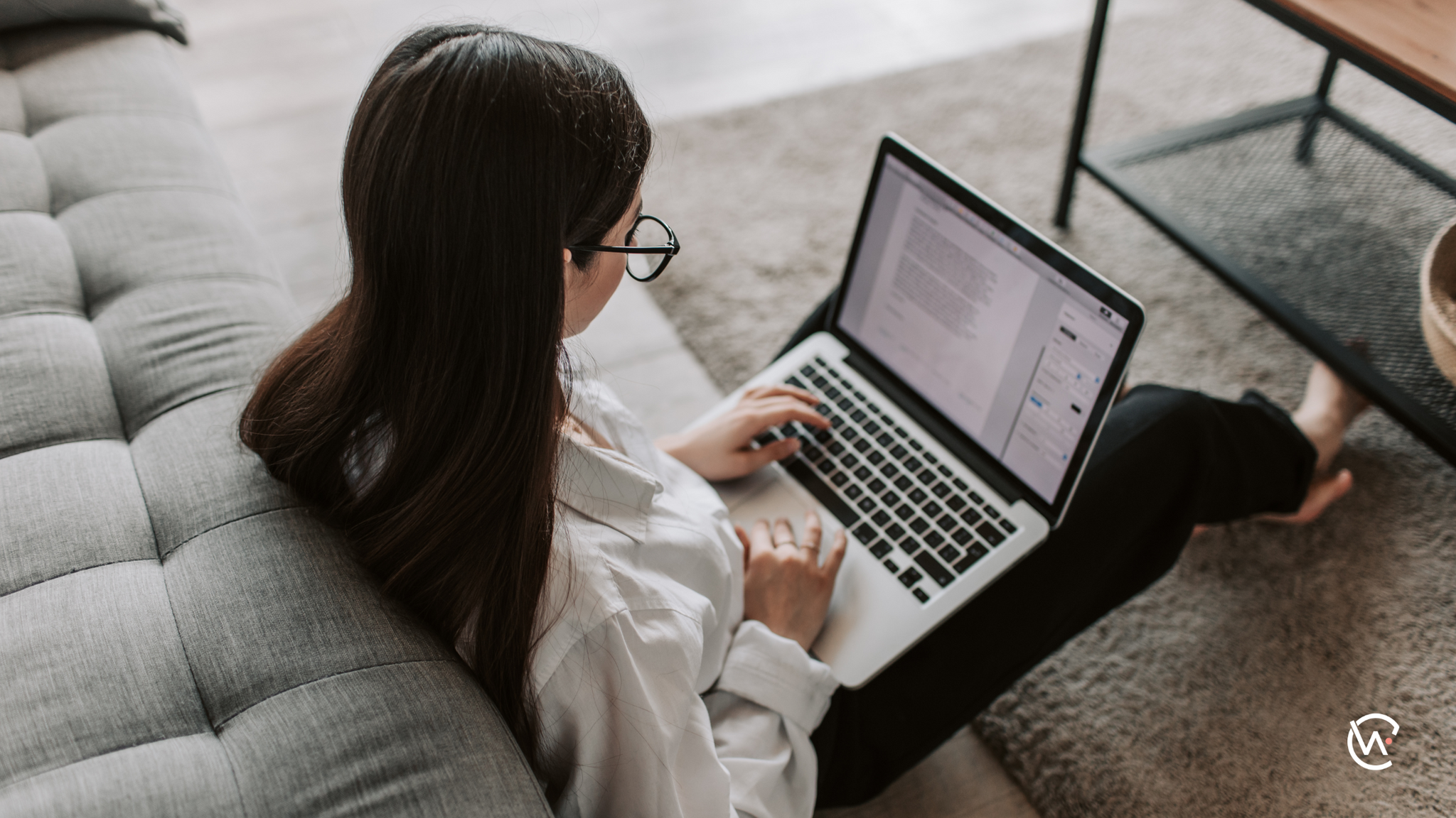 A woman on her laptop in her home
