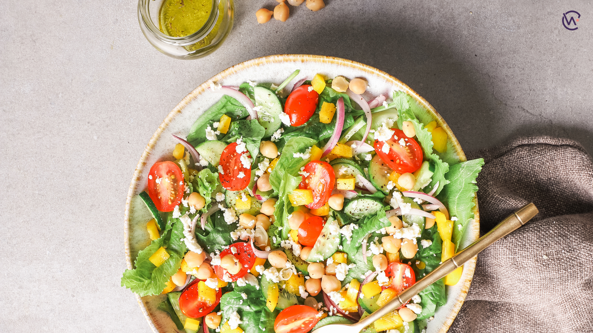 A colourful chickpea salad in a large bowl