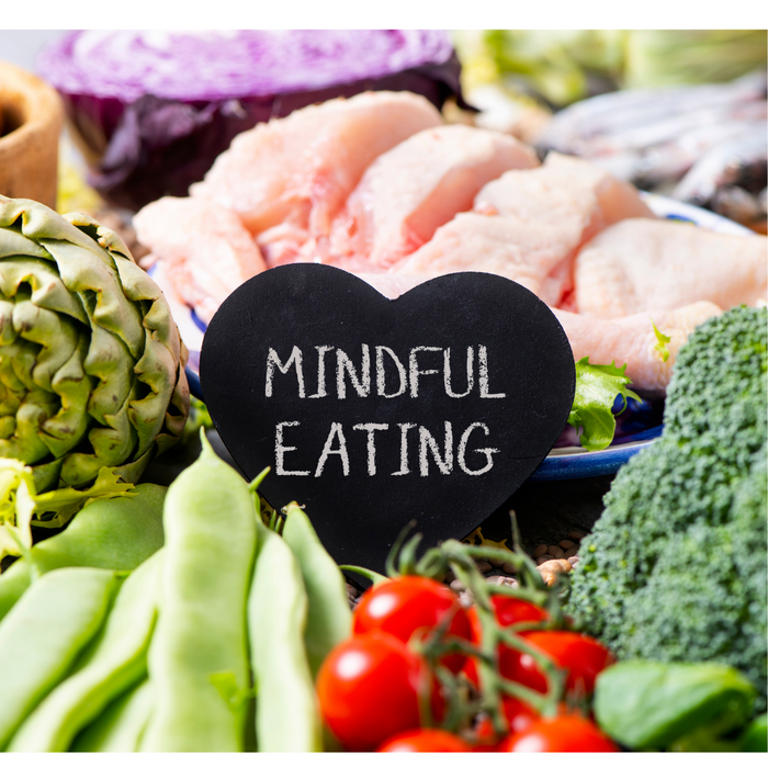 A variety of vegetables with a signt hat says Mindful Eating
